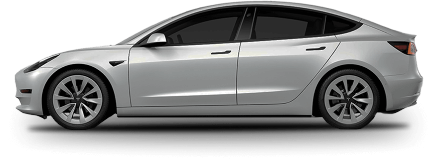 Side view of a silver Tesla Model 3 with aerodynamic lines, flush door handles, and tinted windows. The electric vehicle is shown on a plain background, emphasizing its sleek, modern design.