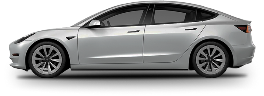 Silver Tesla Model 3 viewed from the side, showcasing dark window tint and smooth body lines.