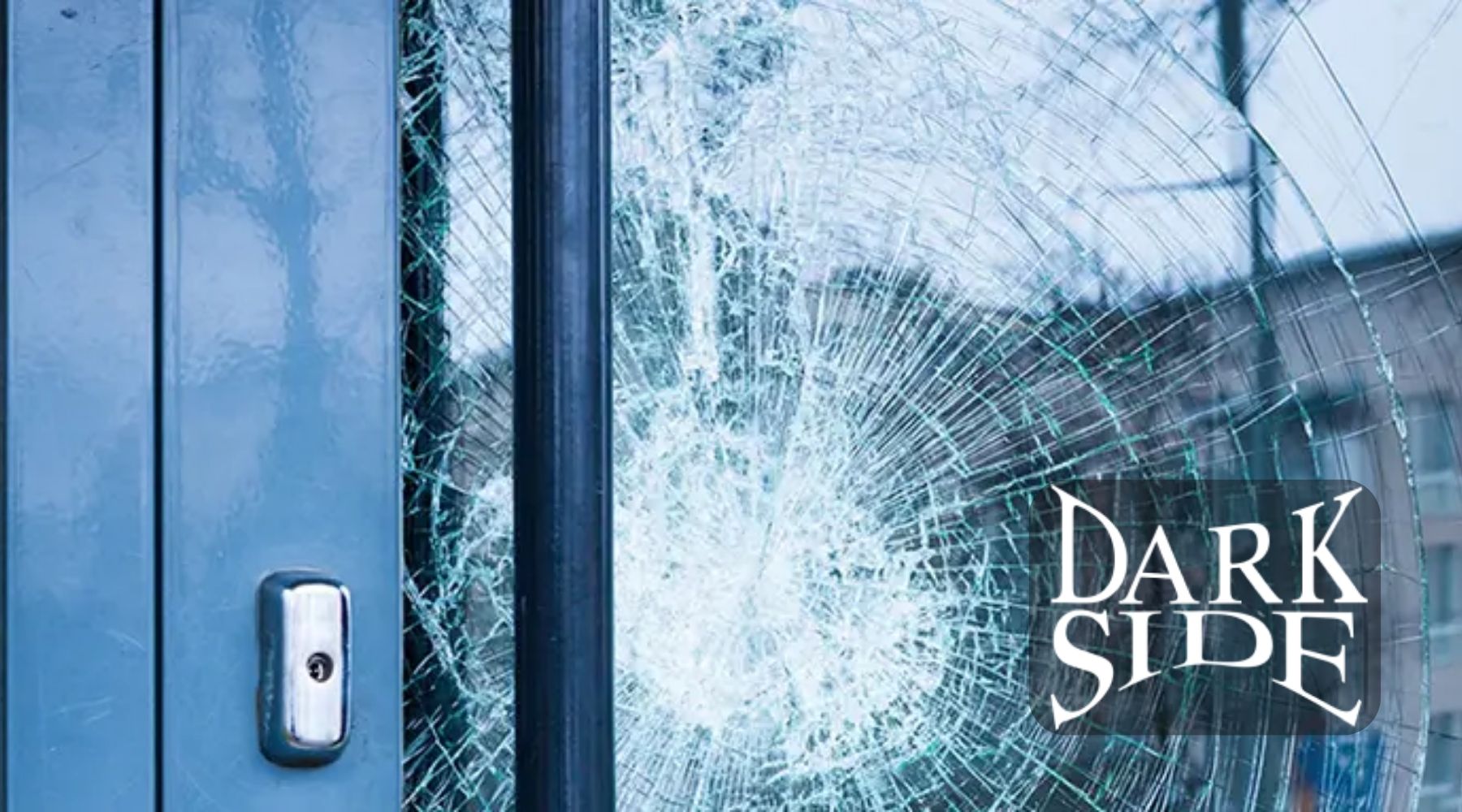Shattered glass door with visible impact cracks demonstrating security window film strength by Dark Side Window Tinting in Augusta GA.