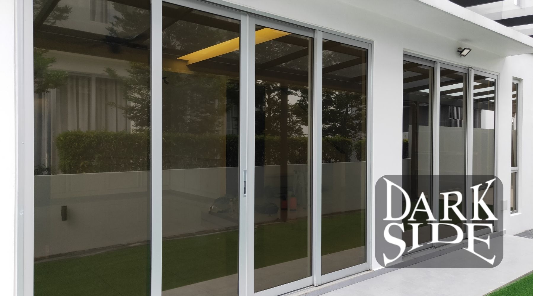 Home window tinting in Augusta, GA installed on modern sliding glass doors to reduce heat and improve energy efficiency