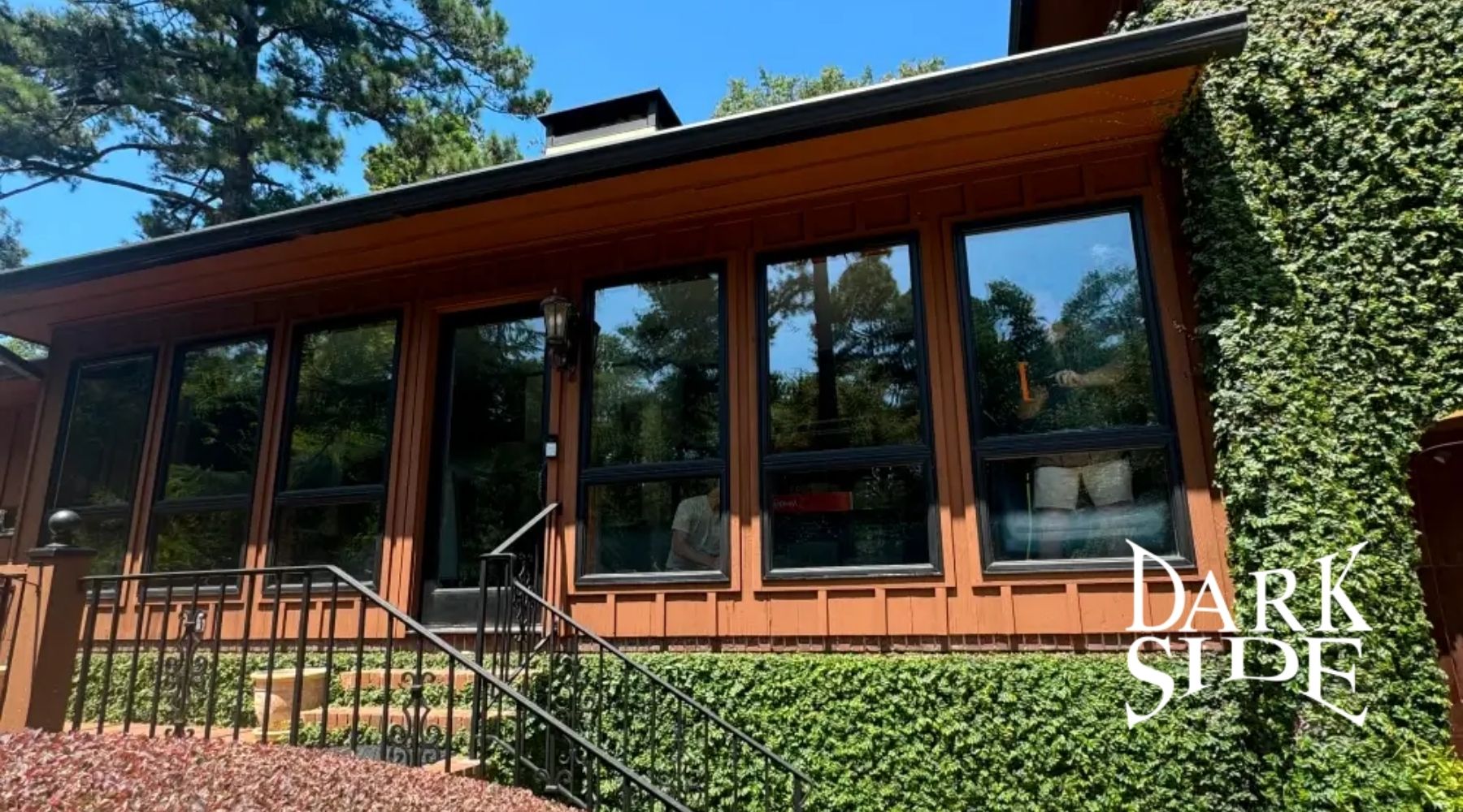 Exterior of an Augusta home with dark residential window tinting installed by Dark Side Window Tinting.