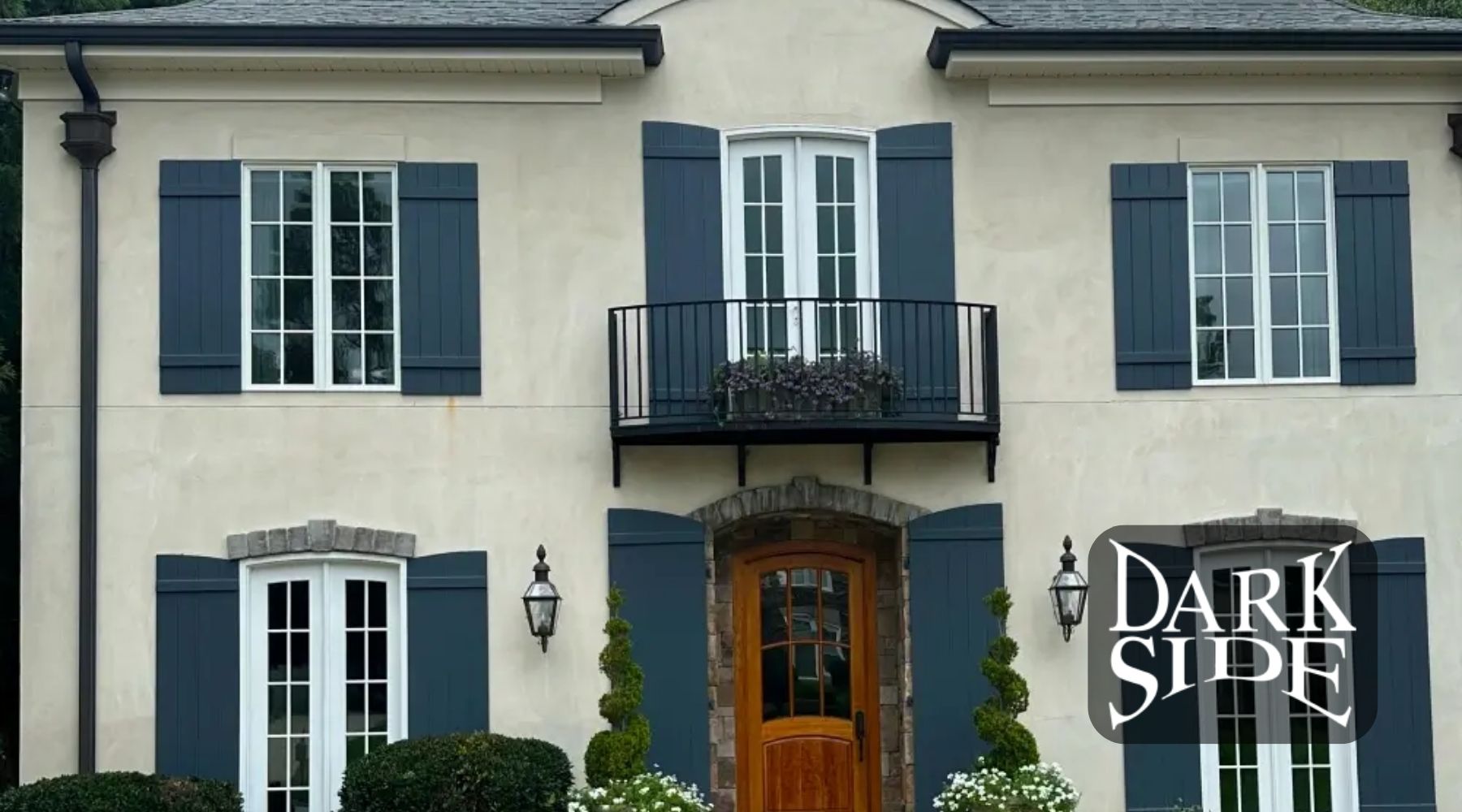 Exterior of an Augusta home with large residential windows and Dark Side Window Tinting branding.